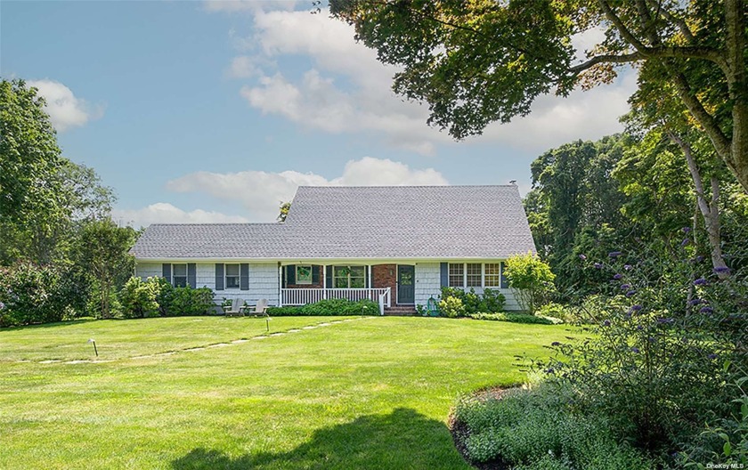 Spacious home with a large living room featuring a wood-burning - Beach Home for sale in Southampton, New York on Beachhouse.com