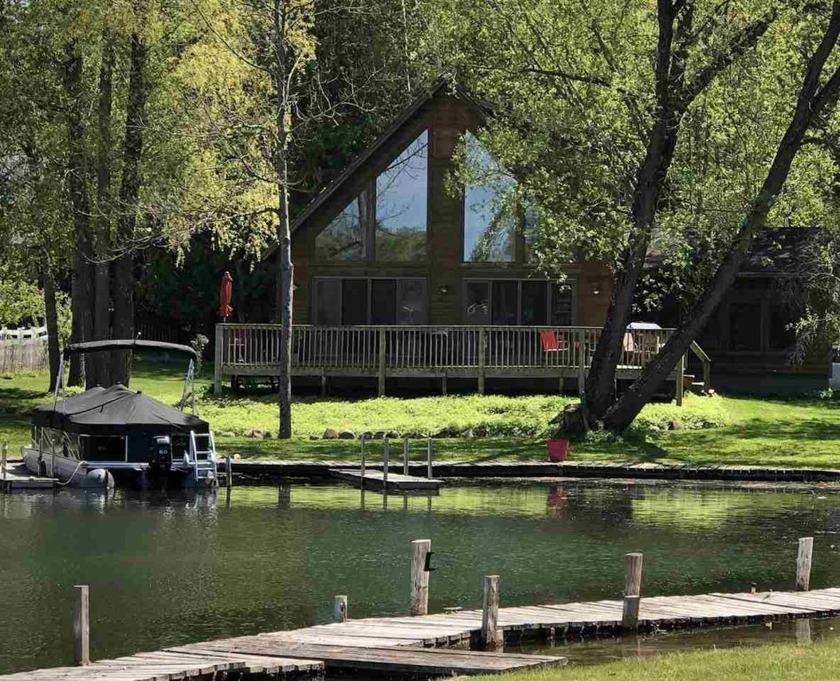 Beautiful log sided, Chalet style home on the Crooked River - Beach Home for sale in Alanson, Michigan on Beachhouse.com