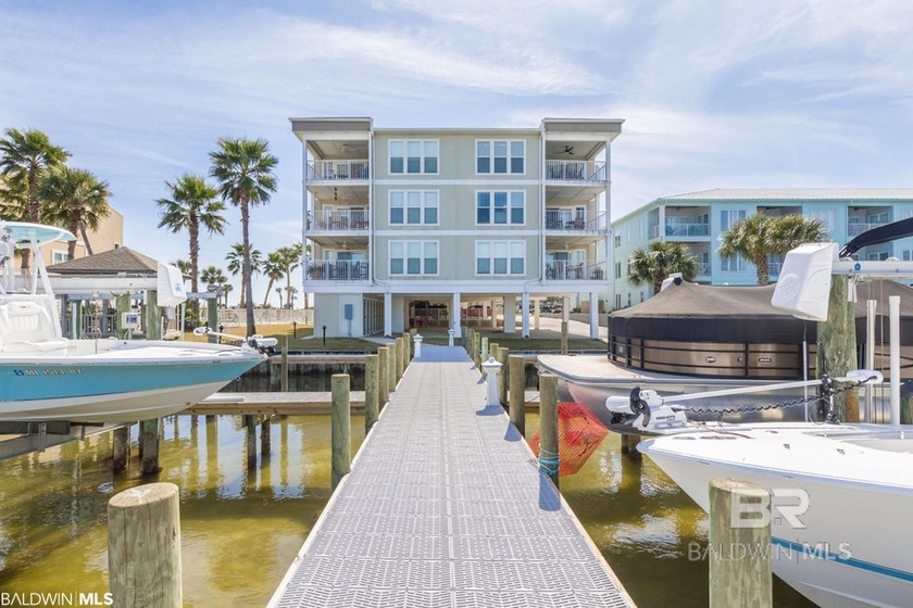 Deep Water Boat slip with lift, power, and water.  Boat slip is - Beach Home for sale in Orange Beach, Alabama on Beachhouse.com
