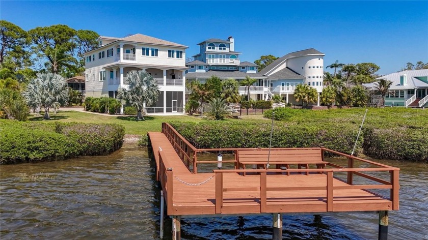Experience the pinnacle of waterfront living in this - Beach Home for sale in Palm Harbor, Florida on Beachhouse.com