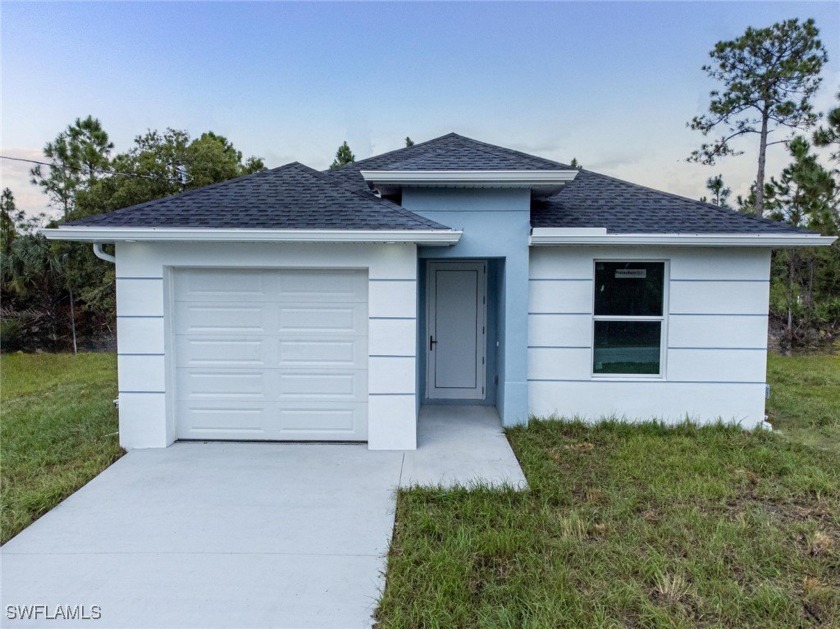 Stunning New Construction Home with Modern Luxury Finishes. This - Beach Home for sale in Lehigh Acres, Florida on Beachhouse.com