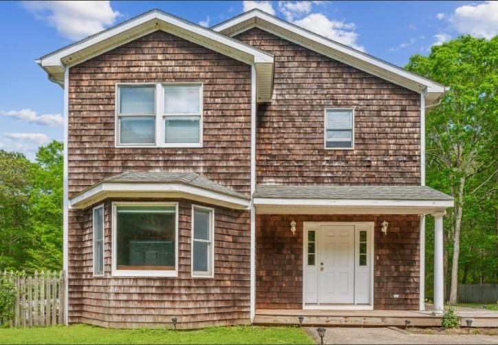 NESTLED DOWN A LONG PRIVATE DRIVEWAY AND BORDERED BY A SERENE - Beach Home for sale in Southampton, New York on Beachhouse.com