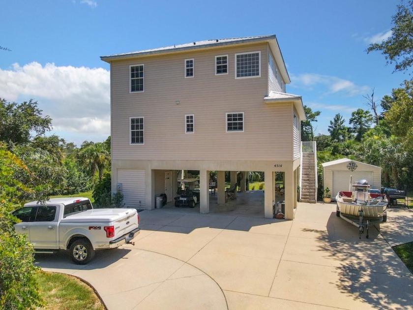 High and Dry! This custom 3 story stilt home is located in - Beach Home for sale in Weeki Wachee, Florida on Beachhouse.com