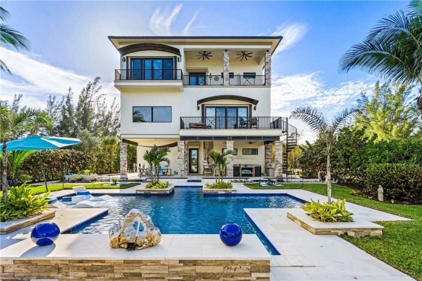 Modern oceanfront estate perfectly infuses luxury & coastal - Beach Home for sale in Hutchinson Island, Florida on Beachhouse.com