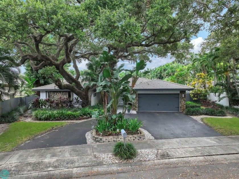 Nestled in the prestigious Lakes of Emerald Hills, this - Beach Home for sale in Hollywood, Florida on Beachhouse.com