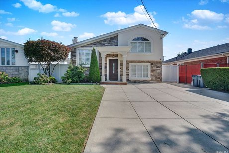 Beautifully Renovated Split Level Home with Backyard!  Come make - Beach Home for sale in Howard Beach, New York on Beachhouse.com