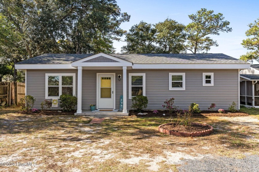 From its welcoming sunny yellow door to the open, airy design - Beach Home for sale in Oak Island, North Carolina on Beachhouse.com