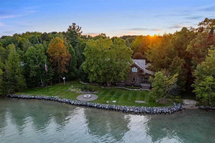 Discover one of Northern Michigan's most distinctive log homes - Beach Home for sale in Kewadin, Michigan on Beachhouse.com