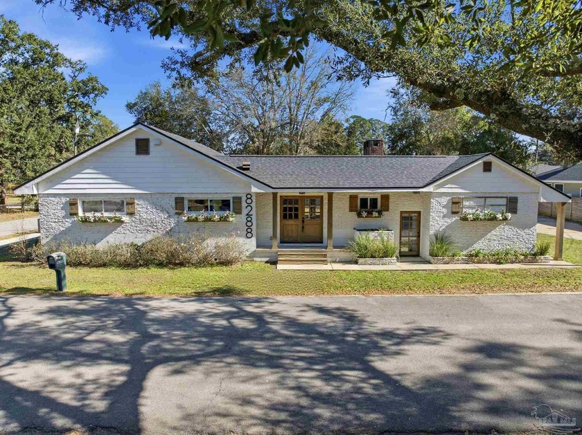 Welcome to this beautifully transformed 1959 corner-lot home - Beach Home for sale in Pensacola, Florida on Beachhouse.com