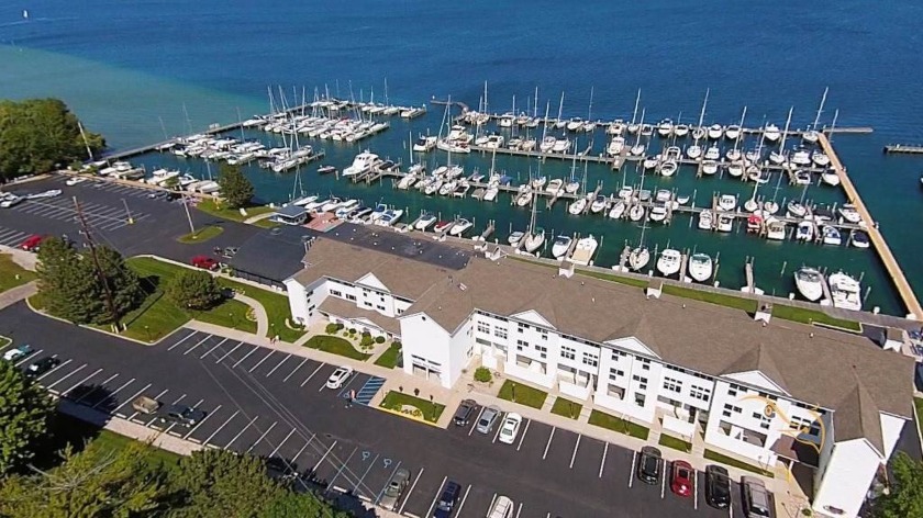 Discover a rare opportunity to secure a 55-foot boat slip at - Beach Lot for sale in Charlevoix, Michigan on Beachhouse.com