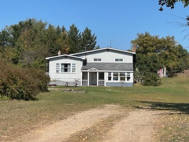 Nestled in  nature, this charming tri-level home offers 4 - Beach Home for sale in Alanson, Michigan on Beachhouse.com