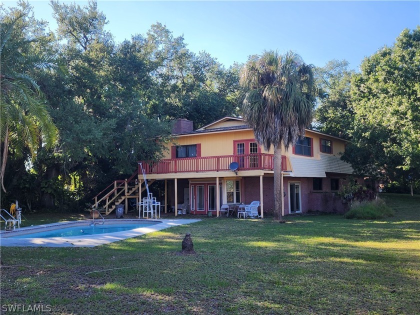 Welcome to your personal botanical garden! 1.2 acres with a - Beach Home for sale in North Fort Myers, Florida on Beachhouse.com