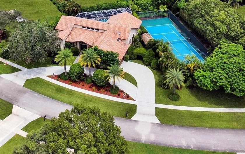 Just 4 min to WEF, this exceptionally secluded Tennis Court - Beach Home for sale in Wellington, Florida on Beachhouse.com