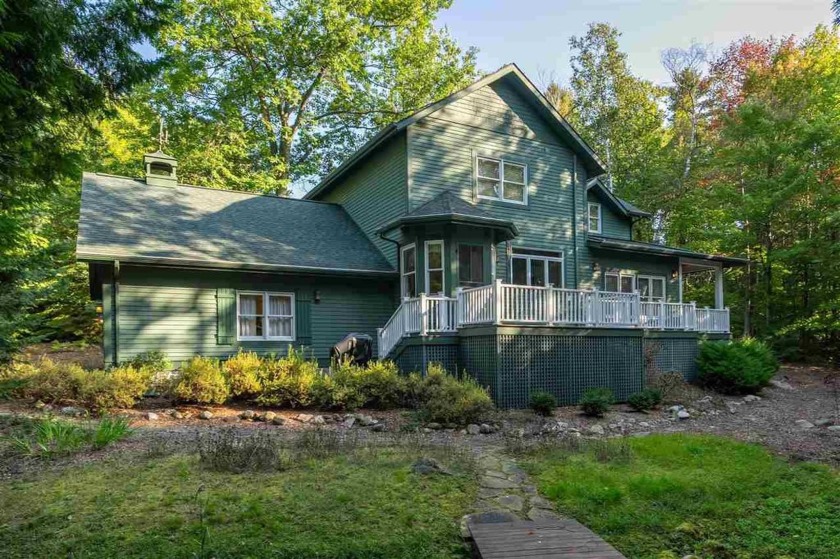 Nestled within the prestigious Charlevoix Country Club, this - Beach Home for sale in Charlevoix, Michigan on Beachhouse.com