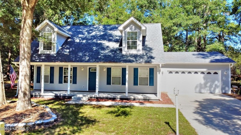 This lovely home is on a corner lot in the community of Goose - Beach Home for sale in Shallotte, North Carolina on Beachhouse.com