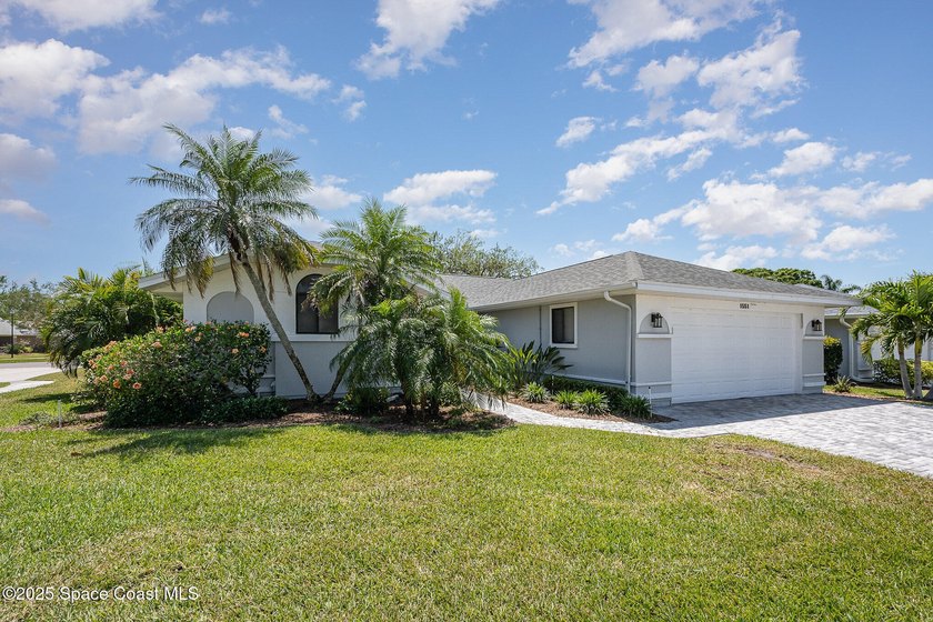 Gorgeous paver driveway and lush landscaping greet you at this - Beach Home for sale in Melbourne, Florida on Beachhouse.com
