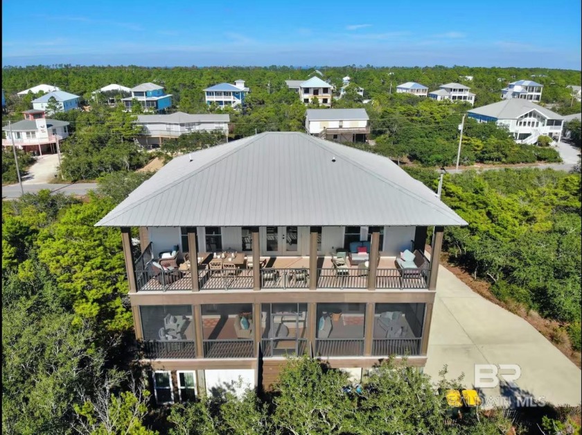 Imagine a custom-built house nestled on a secluded lot, a little - Beach Home for sale in Gulf Shores, Alabama on Beachhouse.com