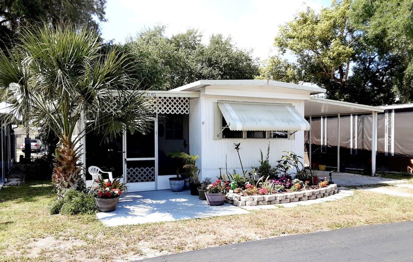 Come see this cozy home in Lake Padgett Village, Land O Lakes! - Beach Home for sale in Land O Lakes, Florida on Beachhouse.com