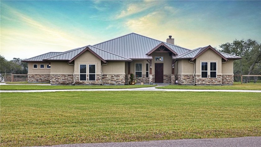 Set behind a sweeping circular drive on a beautifully manicured - Beach Home for sale in Rockport, Texas on Beachhouse.com
