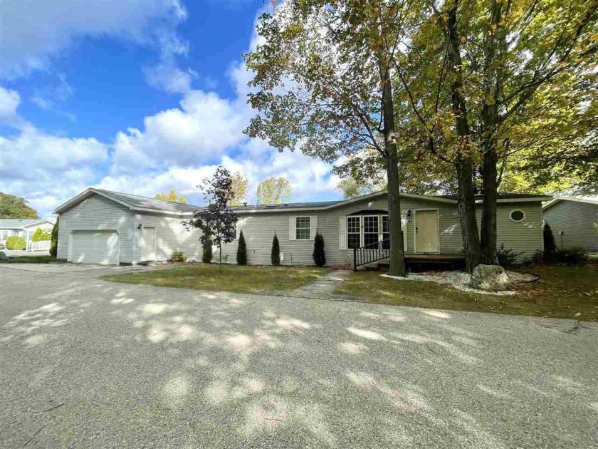 A sweeping view of Lake Michigan is the serene backdrop of this - Beach Home for sale in Charlevoix, Michigan on Beachhouse.com