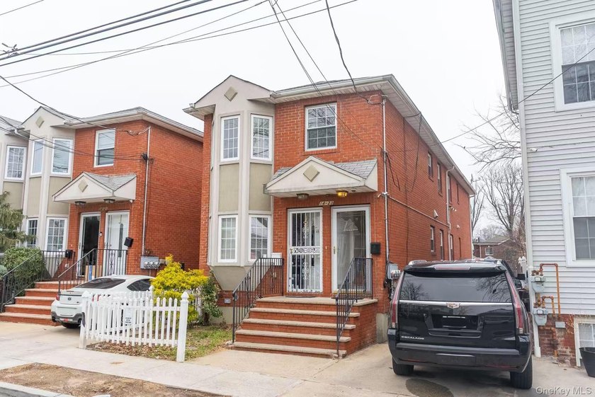 This fully detached, all-brick legal two-family home in College - Beach Home for sale in College Point, New York on Beachhouse.com