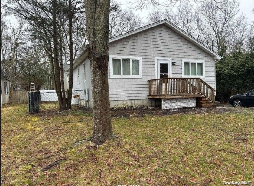 As you step inside, you'll be greeted by the comfort of central - Beach Home for sale in Ridge, New York on Beachhouse.com