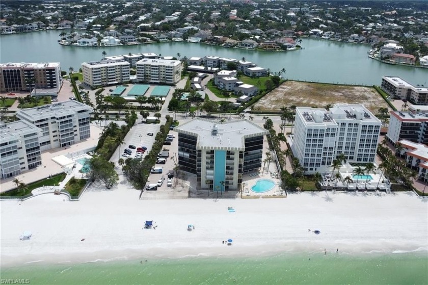 Enjoy beachfront living in this bright and airy condo featuring - Beach Condo for sale in Naples, Florida on Beachhouse.com