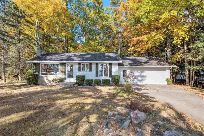 Set on a spacious 0.65-acre lot, this delightful ranch-style - Beach Home for sale in Harbor Springs, Michigan on Beachhouse.com