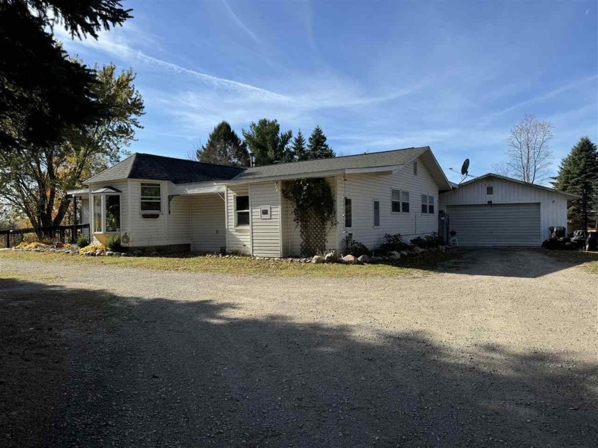 Country living!  Enjoy a large yard with a nice back deck - Beach Home for sale in Alanson, Michigan on Beachhouse.com