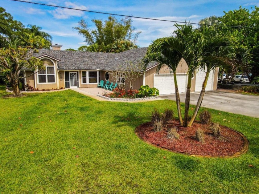 Beautiful 5 BR lake home nestled in lush tropical landscaping - Beach Home for sale in Palm City, Florida on Beachhouse.com