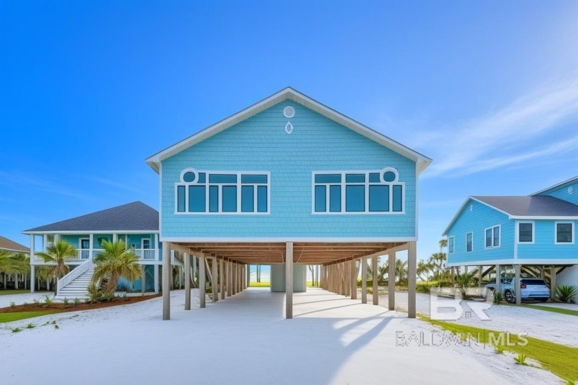 LOOKING FOR A RENTAL MACHINE? This turn-key furnished duplex on - Beach Townhome/Townhouse for sale in Gulf Shores, Alabama on Beachhouse.com