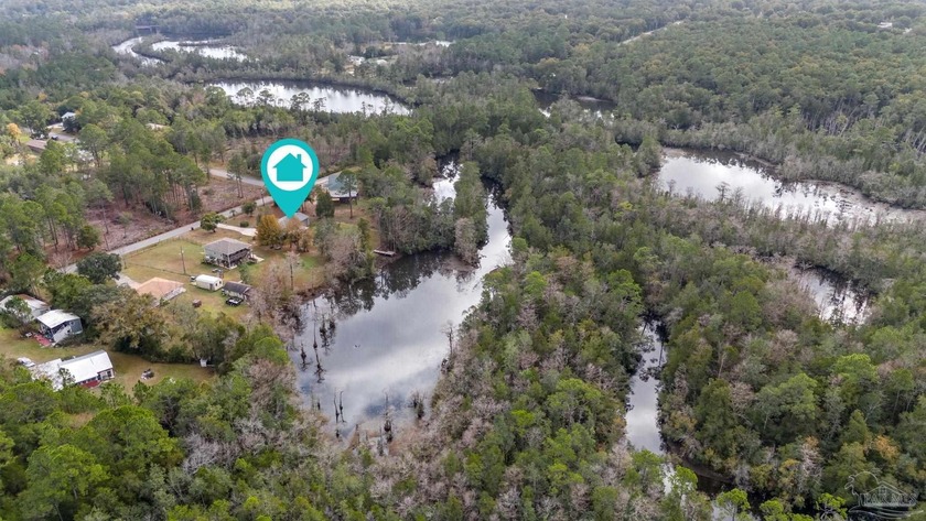 Immaculate waterfront coastal cottage with boat dock, numerous - Beach Home for sale in Milton, Florida on Beachhouse.com