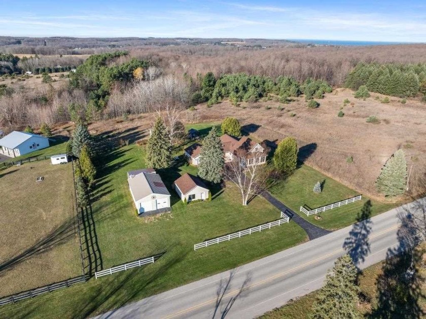 This unique country home features 4 bedrooms and 2 baths, set on - Beach Home for sale in Petoskey, Michigan on Beachhouse.com