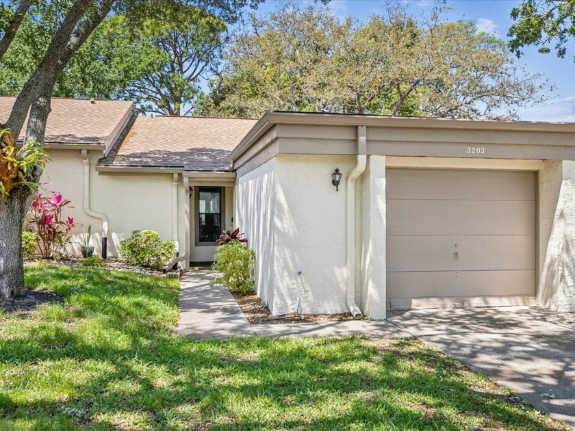 This delightful 2BR/2BA/1 Car Garage villa, nestled in the - Beach Home for sale in Tarpon Springs, Florida on Beachhouse.com