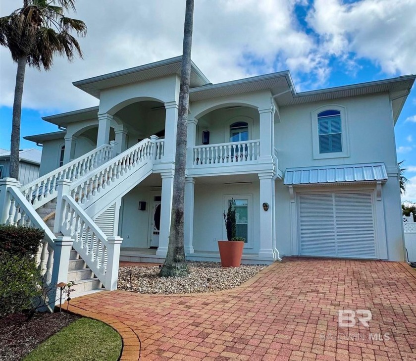 Welcome to this stunning two-story canal-front home, perfectly - Beach Home for sale in Orange Beach, Alabama on Beachhouse.com
