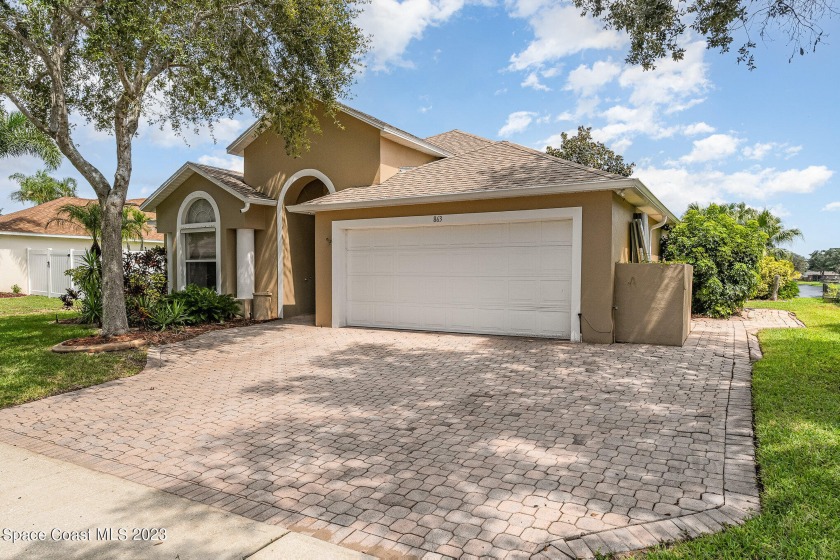 This beautiful home is located in Sunset Lakes, a gated - Beach Home for sale in Merritt Island, Florida on Beachhouse.com