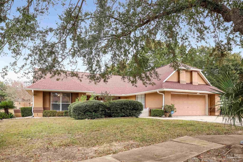 Tucked beneath mature trees in an established Pensacola - Beach Home for sale in Pensacola, Florida on Beachhouse.com