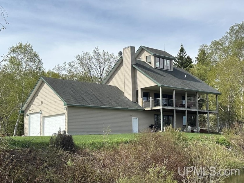 Relax and enjoy this beautiful home on Lake Superior! This - Beach Home for sale in Grand Marais, Michigan on Beachhouse.com