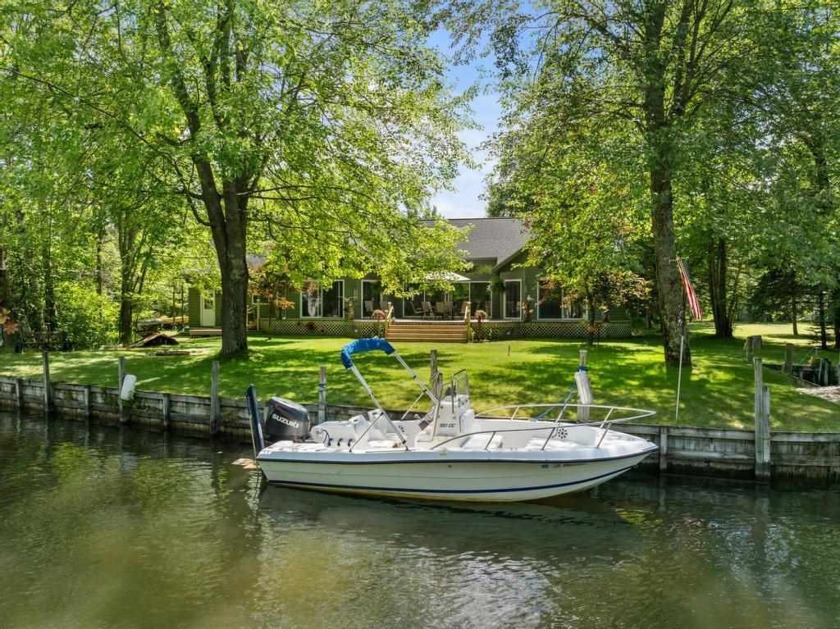 This wonderful waterfront home, situated at the end of a - Beach Home for sale in Alanson, Michigan on Beachhouse.com