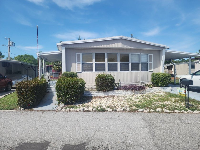 Welcome to this fabulous manufactured double-wide in a wonderful - Beach Home for sale in Pinellas Park, Florida on Beachhouse.com