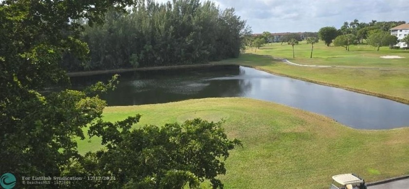 Serene golf course and water views from the large, screened - Beach Condo for sale in Pembroke Pines, Florida on Beachhouse.com