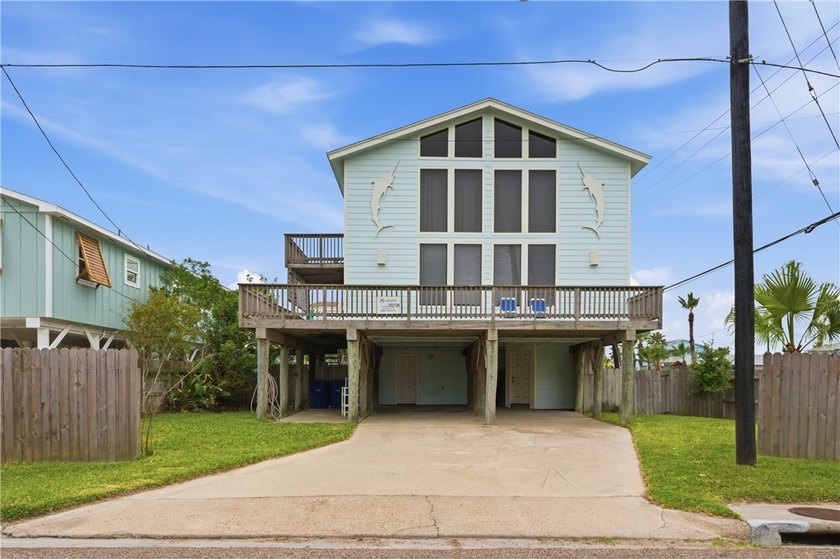 Tucked just off 11th Street, this four-bedroom stilt home puts - Beach Home for sale in Port Aransas, Texas on Beachhouse.com
