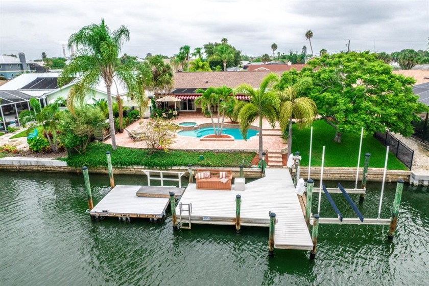 Welcome to your private TROPICAL OASIS! This stunning WATERFRONT - Beach Home for sale in Apollo Beach, Florida on Beachhouse.com