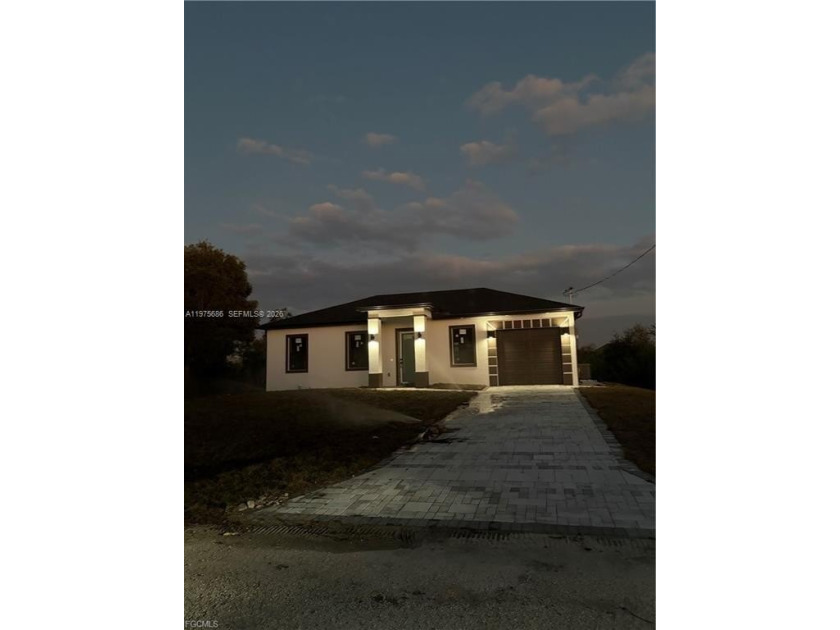 This beautiful home offers 3 bedrooms and 3 bathrooms, all - Beach Home for sale in Lehigh Acres, Florida on Beachhouse.com