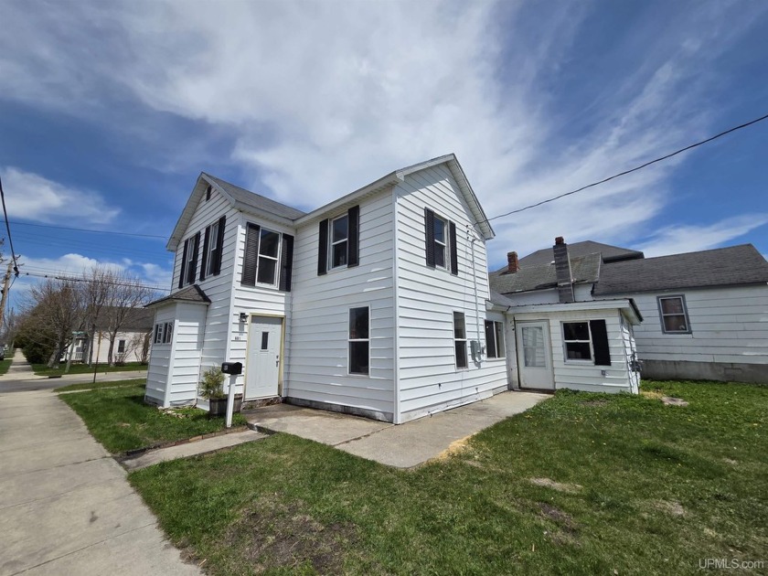 Here is the perfect blend of history and modern comfort! This - Beach Home for sale in Manistique, Michigan on Beachhouse.com