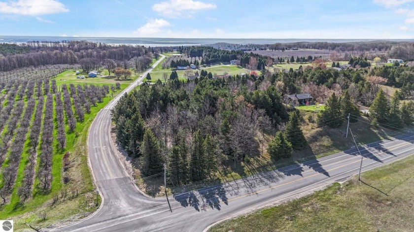 Introducing a lovely wooded parcel, located at the corner of - Beach Acreage for sale in Cedar, Michigan on Beachhouse.com