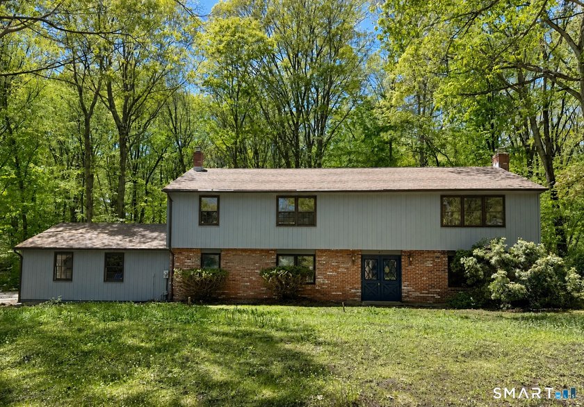 Set on a quiet cul-de-sac in the beautiful Meadow Hills Lake - Beach Home for sale in Guilford, Connecticut on Beachhouse.com