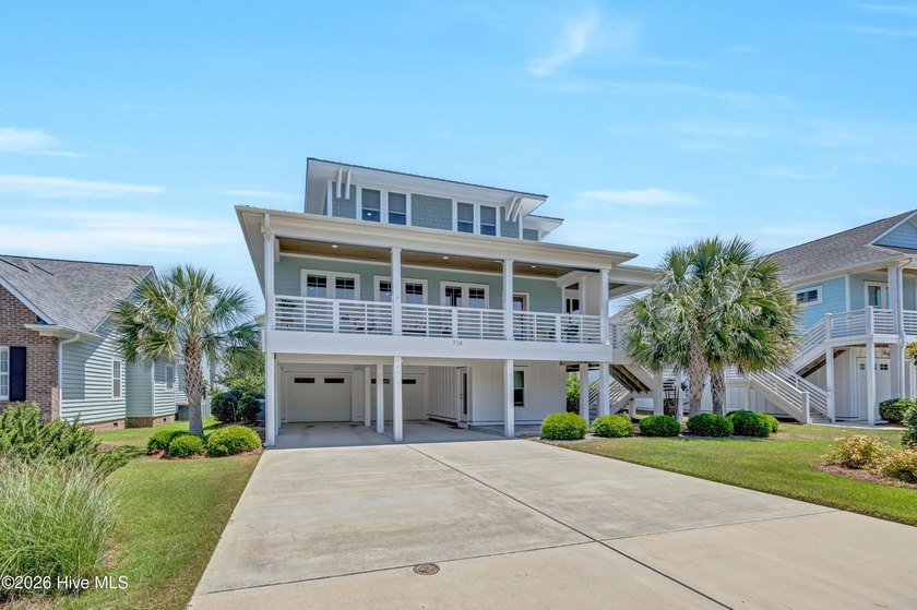 Experience Coastal Luxury redefined in this exceptional - Beach Home for sale in Kure Beach, North Carolina on Beachhouse.com