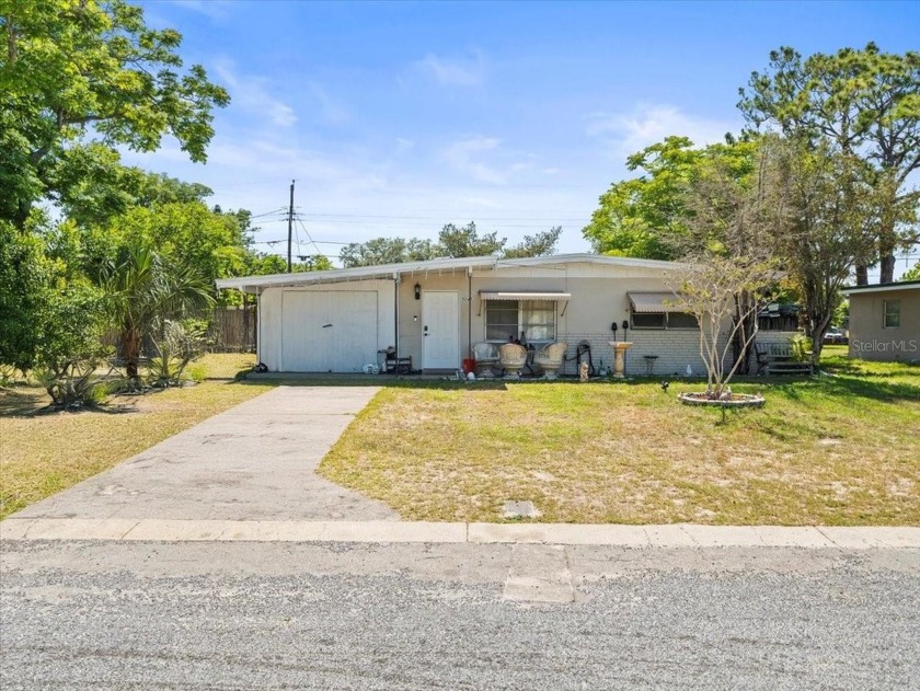 Opportunity awaits with this 2-bedroom, 1-bathroom home ideally - Beach Home for sale in New Port Richey, Florida on Beachhouse.com