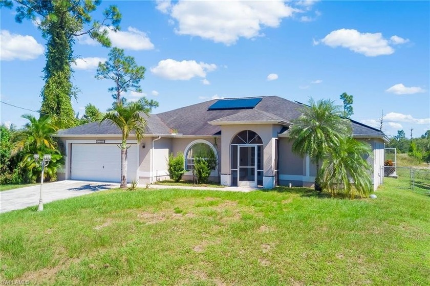 Spacious four-bedroom, two-and-a-half-bath pool home offering - Beach Home for sale in Lehigh Acres, Florida on Beachhouse.com